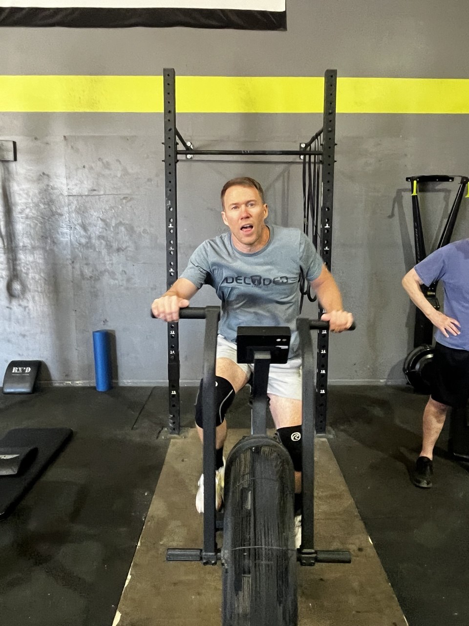 Member grinding it out on the air bike