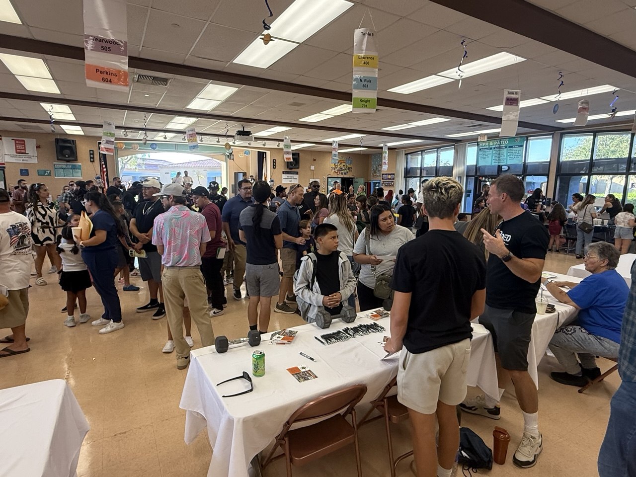 Decoded team repping the gym at a community event booth