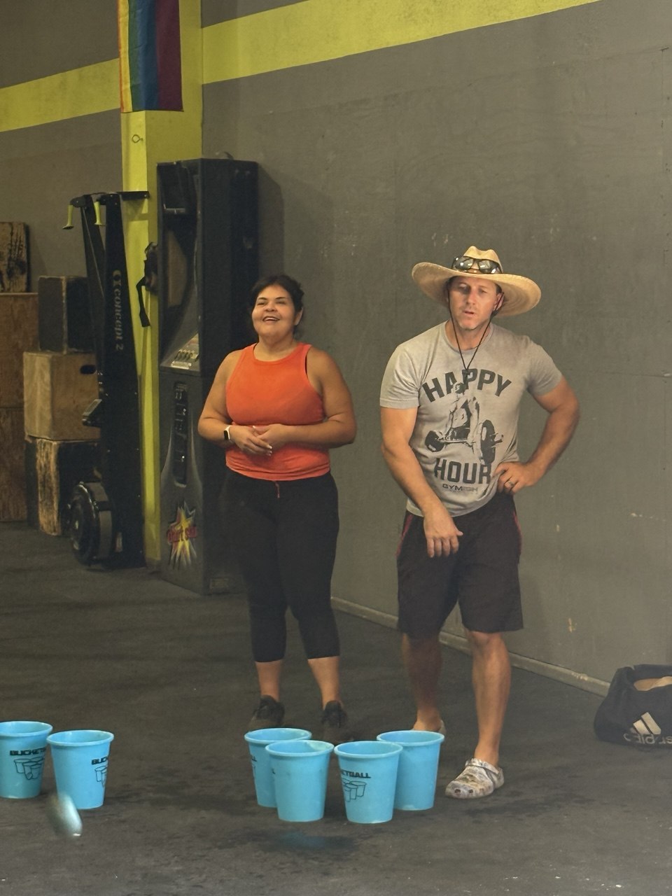 Members laughing during a bucket-ball game night