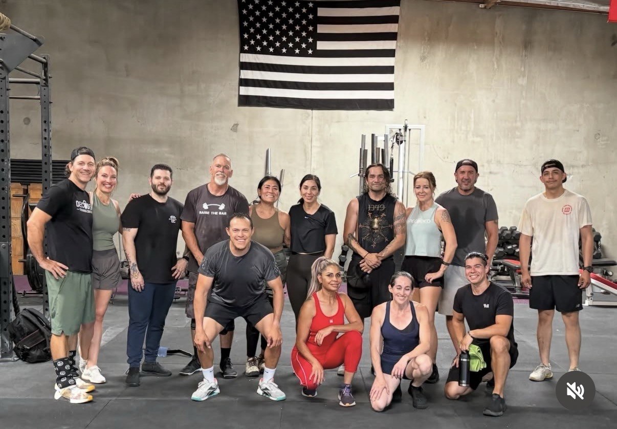 Big group photo under the American flag