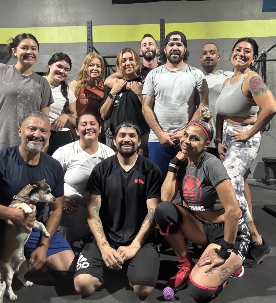 Group team photo with a member's dog up front