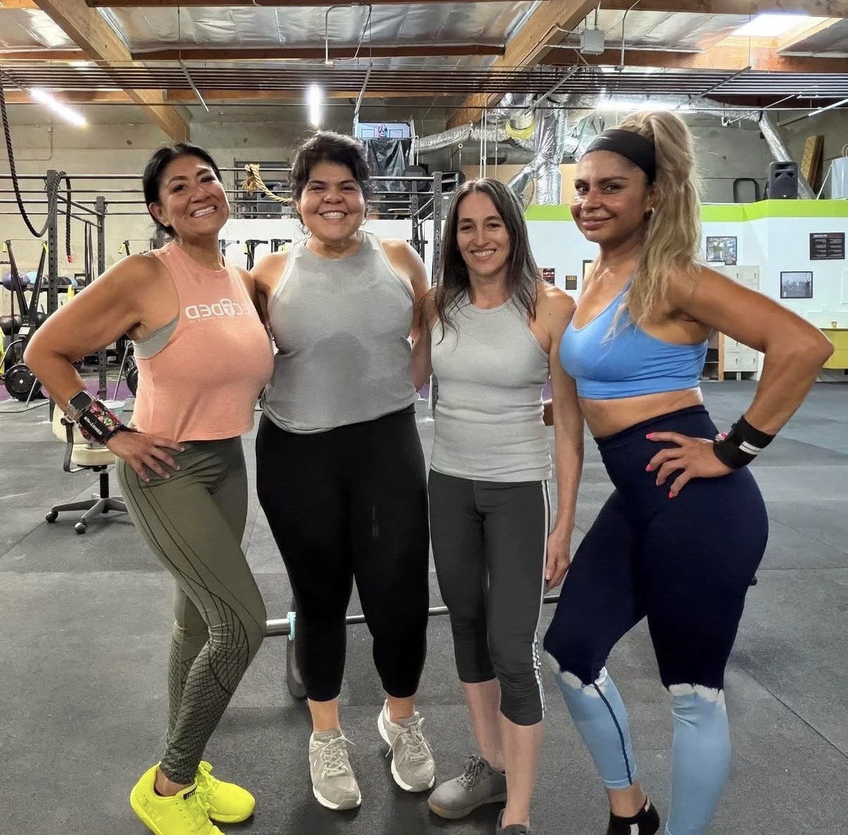 Four members posing together after class