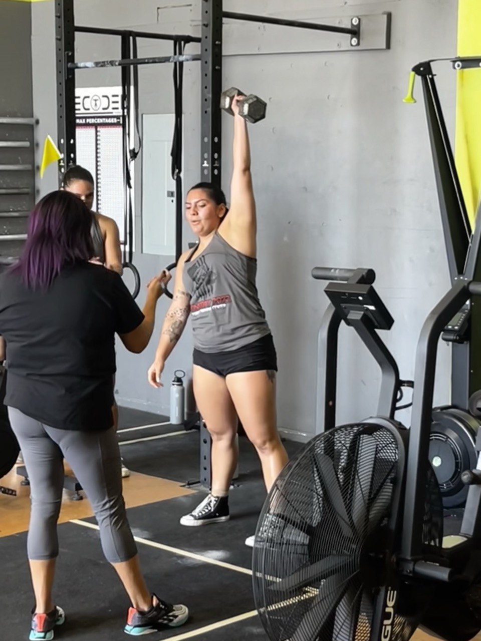 Doomsday 2023 dumbbell snatch with coach spotting