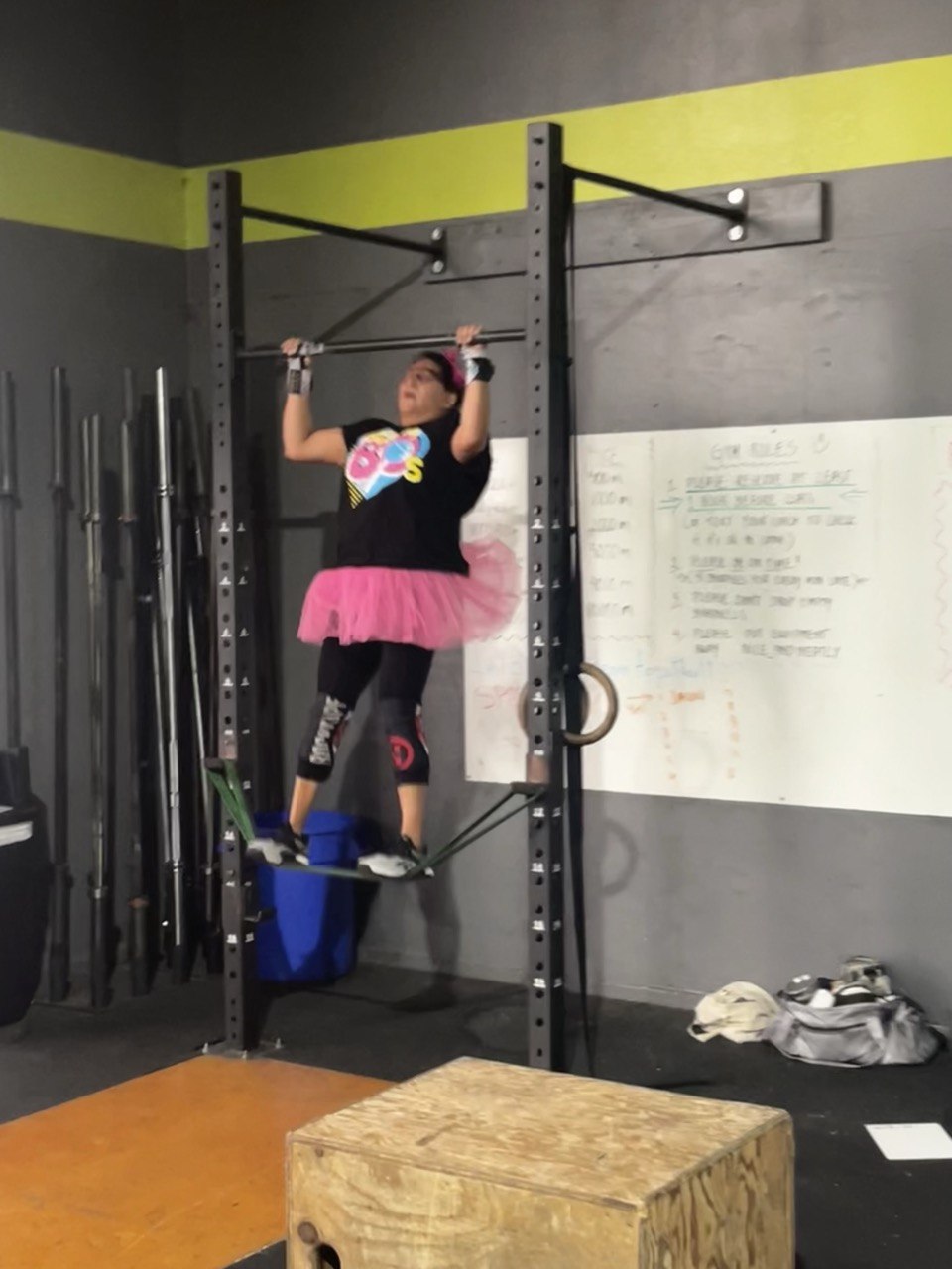 First Friday 80's Night, member in tutu on the pull-up bar