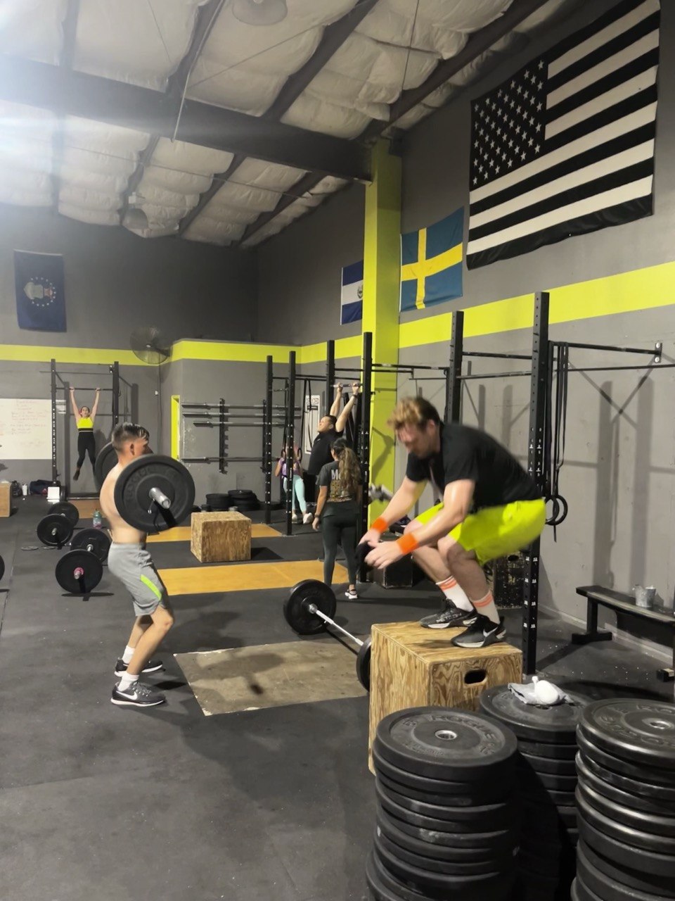 First Friday 80's Night, barbell and box jumps on the floor