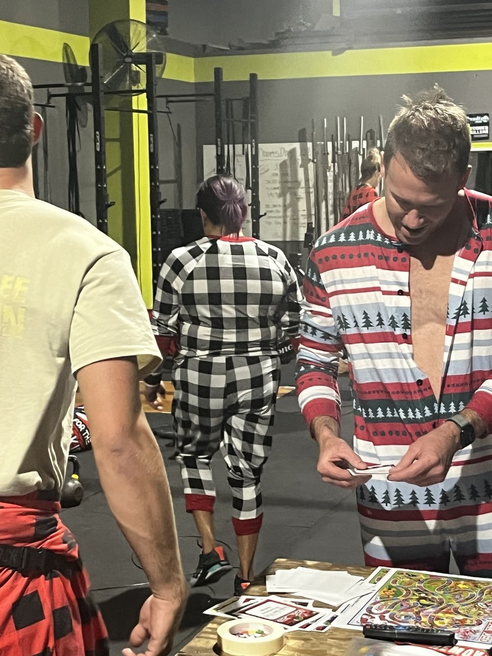 Winter Pajama Party members in holiday pajamas with scorecards