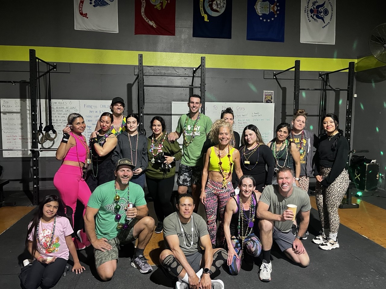 First Friday Mardi Gras group photo in beads