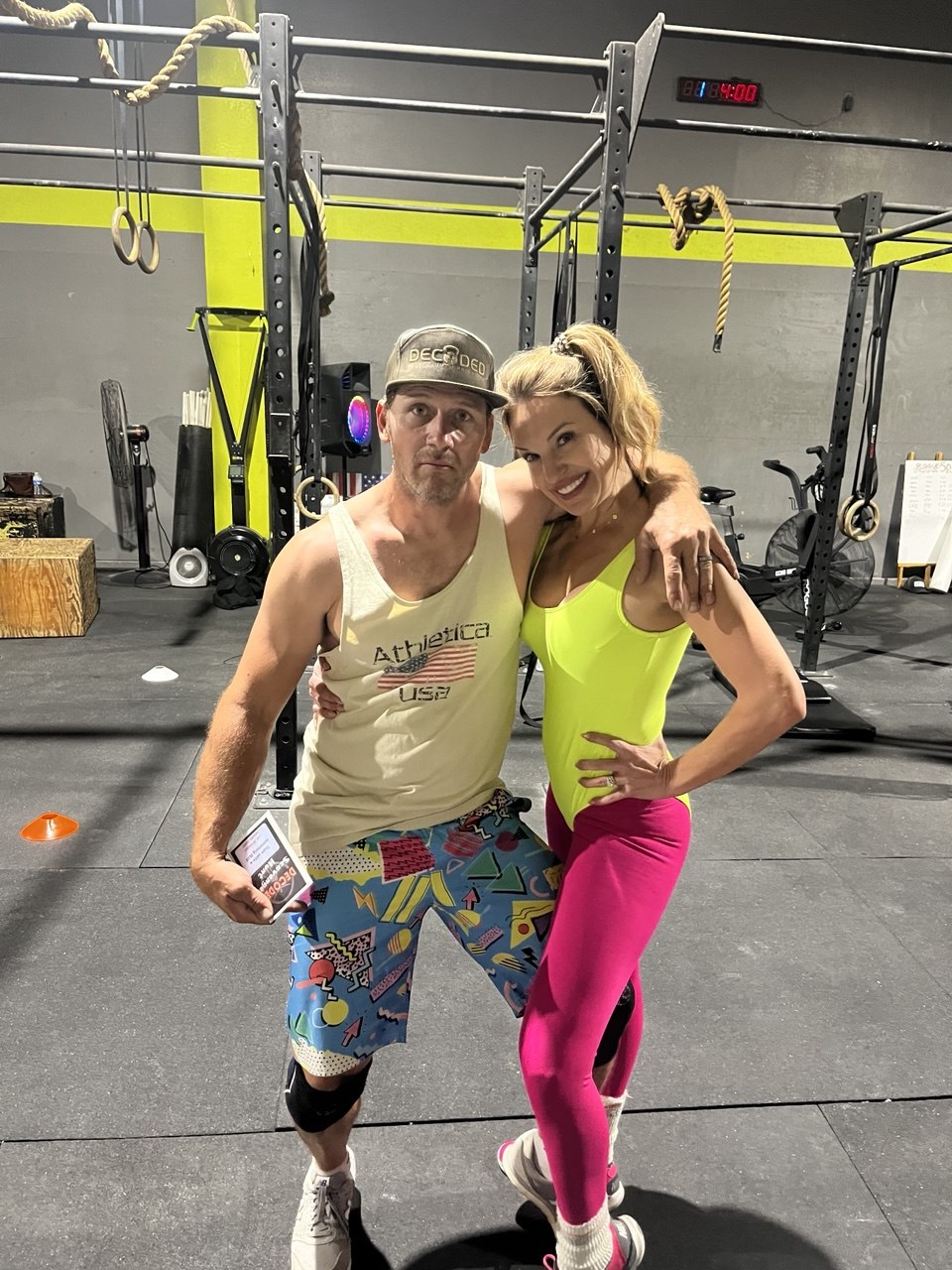 First Friday 80's Night neon couple with scorecard